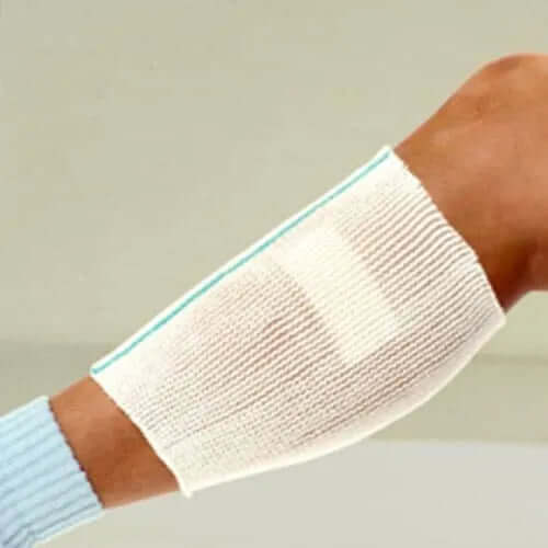 X Span Tubular Dressing Retainer displayed on a model leg