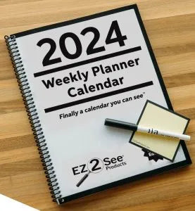 Cover of a 2024 EZ2See Weekly Planner Calendar with Sticky Note and Pen